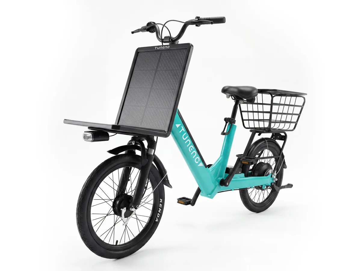 Laineng E03 solar electric bike in teal with front solar panel and basket, front quarter view